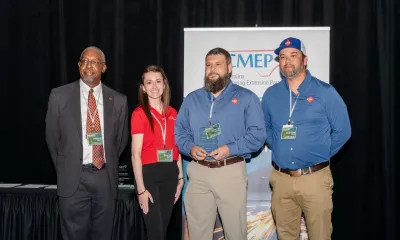 We Pack officials receiving award.