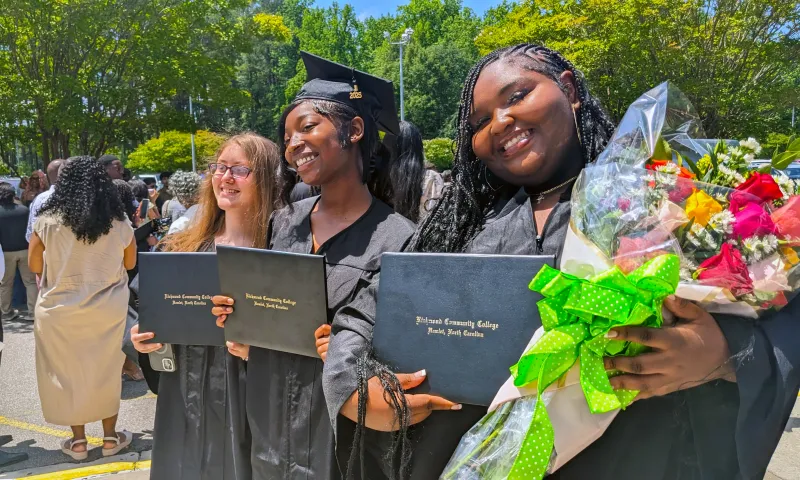 Graduates smiling