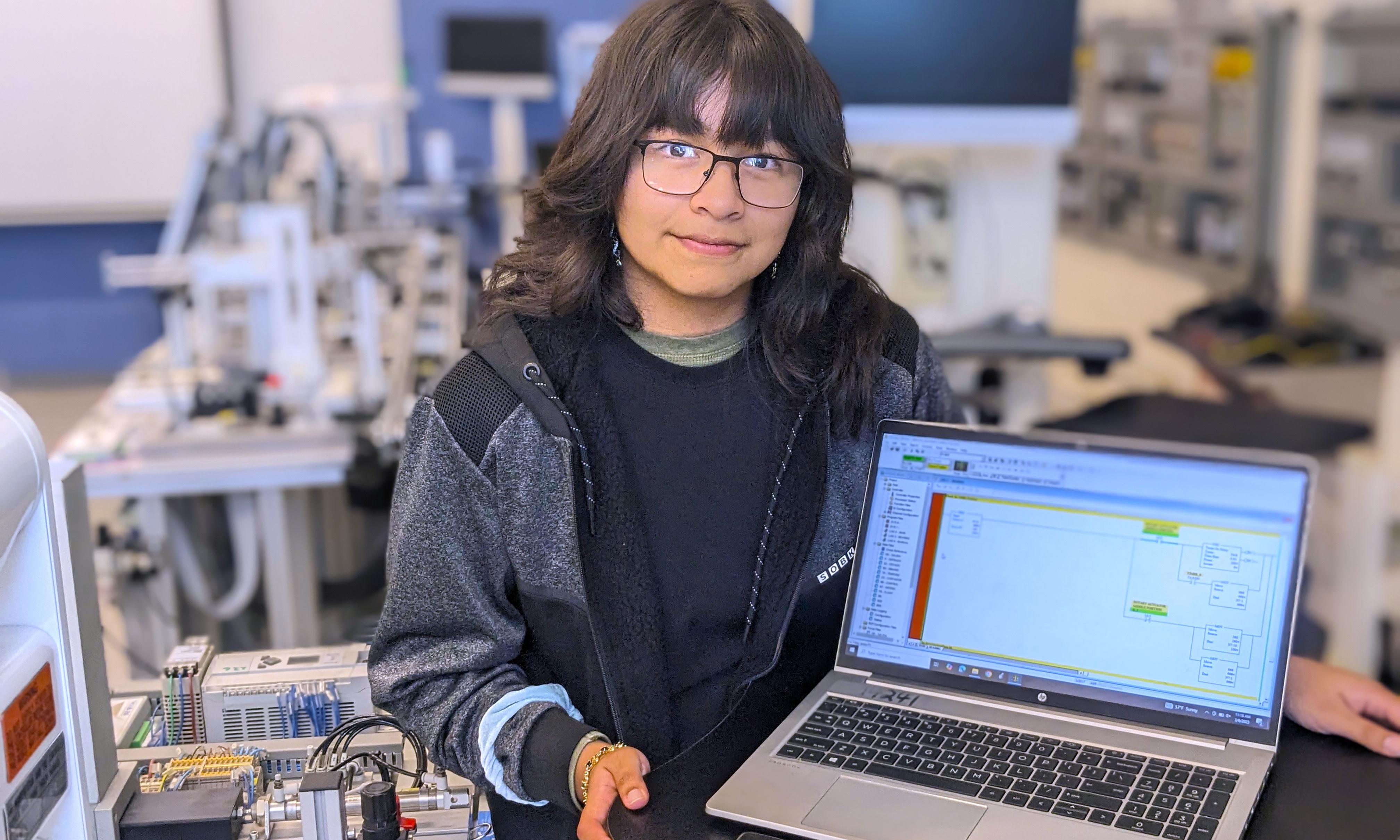 Ellen Carrillo Mayoral stands in Mechatronics Lab.